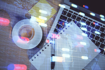 Double exposure of data drawing hologram over topview of study desk background with computer. Concept of Ai.