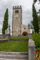 Fototapeta na wymiar Old catholic church on a background of blue sky with clouds