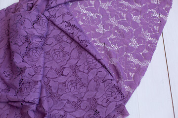 background texture of the fabric guipure veil mesh fabric purple. cloth. the fashion fabric. floral...