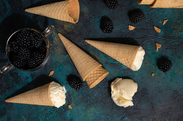 Blackberry ice-cream on green and black texture, with hard light, creative photo, Summer mood