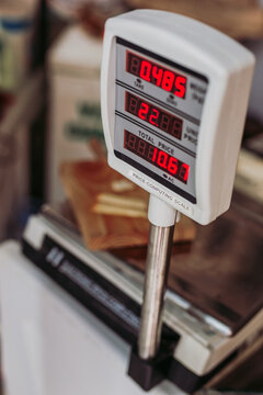 From above weighing machine with electronic display placed on counter in local food store