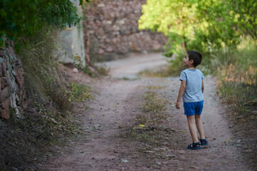 child walking on a path