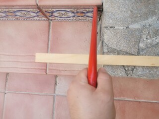 cutting wood with a saw