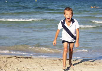 Crying boy on a sea background