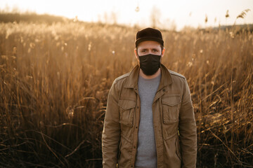 young guy in a protective mask 