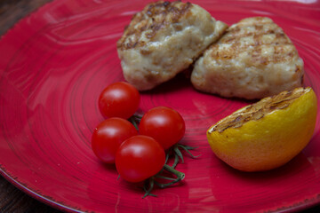 meat cutlets with vegetables close-up on a decorative background. Fried meat, meat dish