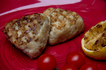 meat cutlets with vegetables close-up on a decorative background. Fried meat, meat dish