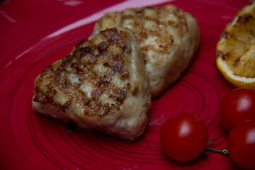 meat cutlets with vegetables close-up on a decorative background. Fried meat, meat dish