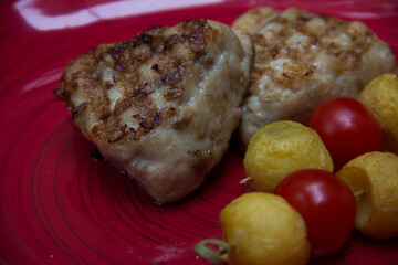 meat cutlets with vegetables close-up on a decorative background. Fried meat, meat dish