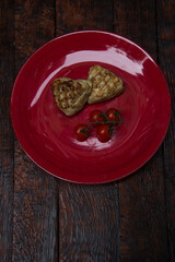 meat cutlets with vegetables close-up on a decorative background. Fried meat, meat dish