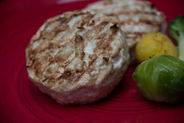 meat cutlets with vegetables close-up on a decorative background. Fried meat, meat dish