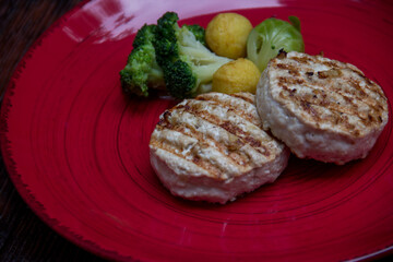 meat cutlets with vegetables close-up on a decorative background. Fried meat, meat dish
