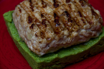 fried meat on a spinach pillow close-up. Dish of meat. Meat food
