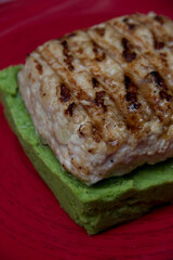 fried meat on a spinach pillow close-up. Dish of meat. Meat food