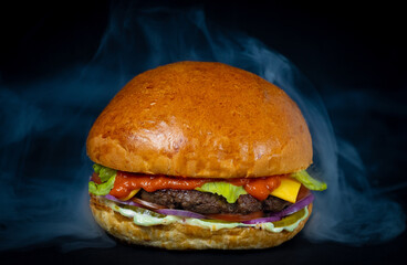 Burger cheeseburger barbeque sandwich with beef cheese and fresh vegetables hot with steam smoke on black background with free text space banner