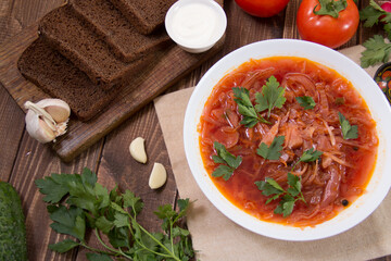 photo for menu, Ukrainian and Russian traditional beetroot soup - borscht with sour cream garlic pepper and sauce, Ukrainian borscht with sour cream, food background, Food and health