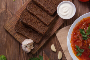 photo for menu, Ukrainian and Russian traditional beetroot soup - borscht with sour cream garlic pepper and sauce, Ukrainian borscht with sour cream, food background, Food and health