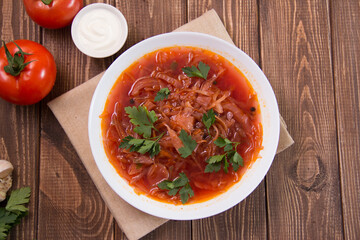 photo for menu, Ukrainian and Russian traditional beetroot soup - borscht with sour cream garlic pepper and sauce, Ukrainian borscht with sour cream, food background, Food and health