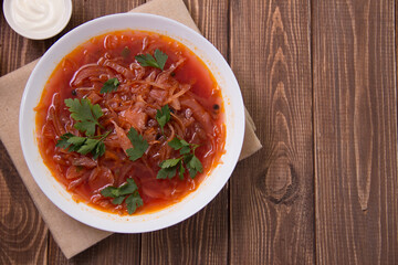 photo for menu, Ukrainian and Russian traditional beetroot soup - borscht with sour cream garlic pepper and sauce, Ukrainian borscht with sour cream, food background, Food and health