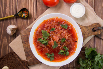 photo for menu, Ukrainian and Russian traditional beetroot soup - borscht with sour cream garlic pepper and sauce, Ukrainian borscht with sour cream, food background, Food and health