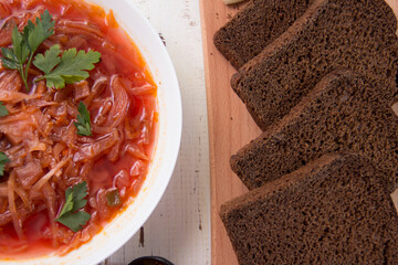 sliced ​​brown bread on wooden background close-up