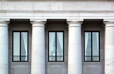 Abstract, black and white, fine art photography of stone landmark building exteriors including windows, columns, roof architecture and decorative features.