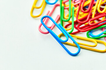 Colored paper clips on white background Close up Macro Selective focus
