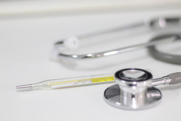 Stethoscope isolated equipment on white texture with blurred background