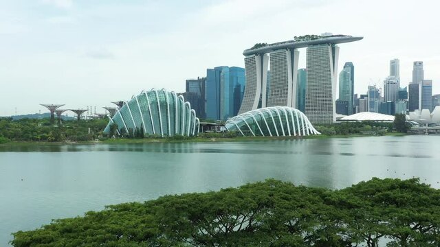 View from above, stunning aerial view of the skyline of Singapore during a cloudy day with the financial district in the distance.