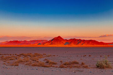 Fototapeta na wymiar Mountains of the Namib Desert in the sunset in Sossusvlei in Namibia