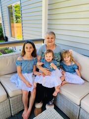 Close up portrait of Beautiful Grandmother and three Granddaughters, happy generation  