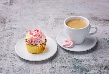 Appetizing cupcake with cream and coffee