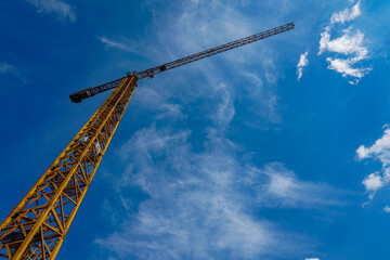 Construction crane against a blue sky.