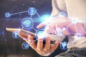 Double exposure of man's hands holding and using a phone and social network theme drawing.