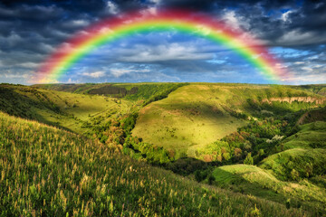 Beautiful landscape with a rainbow in the sky