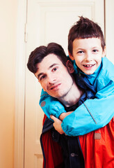 Obraz premium faher and son together having fun at home, lifestyle happy family, people at home