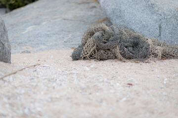 Fishing nets on dock port. Fish traps cast on the sandy beach
