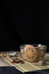 Lotus root soup with beans in a bowl and Chinese herbs, shiitake mushroom, lotus root