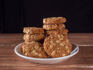 homemade whole oatmeal cookies lined up and two cookies close-up