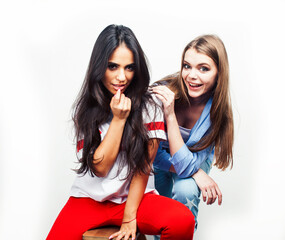 best friends teenage girls together having fun, posing emotional on white background, besties happy smiling, lifestyle people concept, blond and brunette multi nations