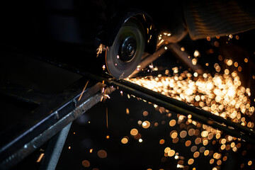 Metal processing. Sparks from the grinder. 