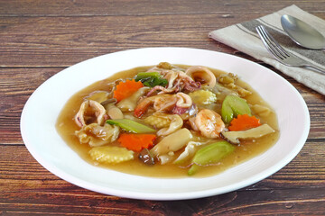 Flat rice noodle in seafood gravy, famous Cantonese food. Selective focus