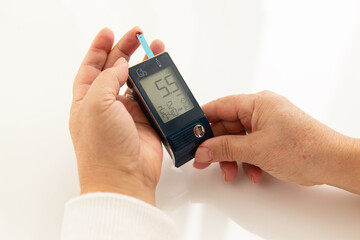 Checking blood glucose level with a glucose meter it is normal
