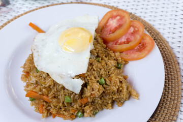 Asian fried rice nasi goreng with chicken and egg...