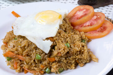 Asian fried rice nasi goreng with chicken and egg...