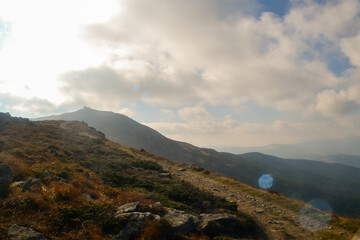 Beautiful view of landscape of mountains, forest and meadows in the Carpathians  in sunny  cloudy weather