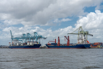 Cargo ships at port to load and unload containers. 
