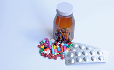 Ferrous Fumarate pills, blister packs with color tablets, capsules, vitamins in brown bottle for...