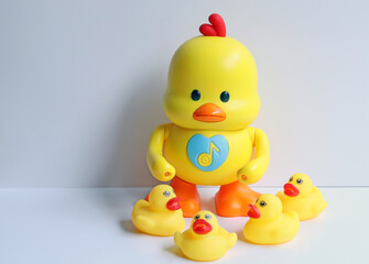 Big toy duck yellow with small duck yellow made from plastic for children, has a music and can dancing. Funny toy for development the kids. Learning and listening for kid concept isolated in studio.