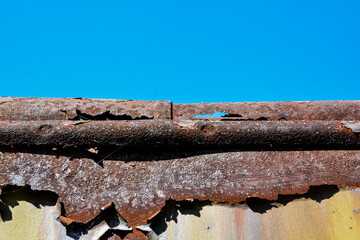 Rusty roof against a clear sky